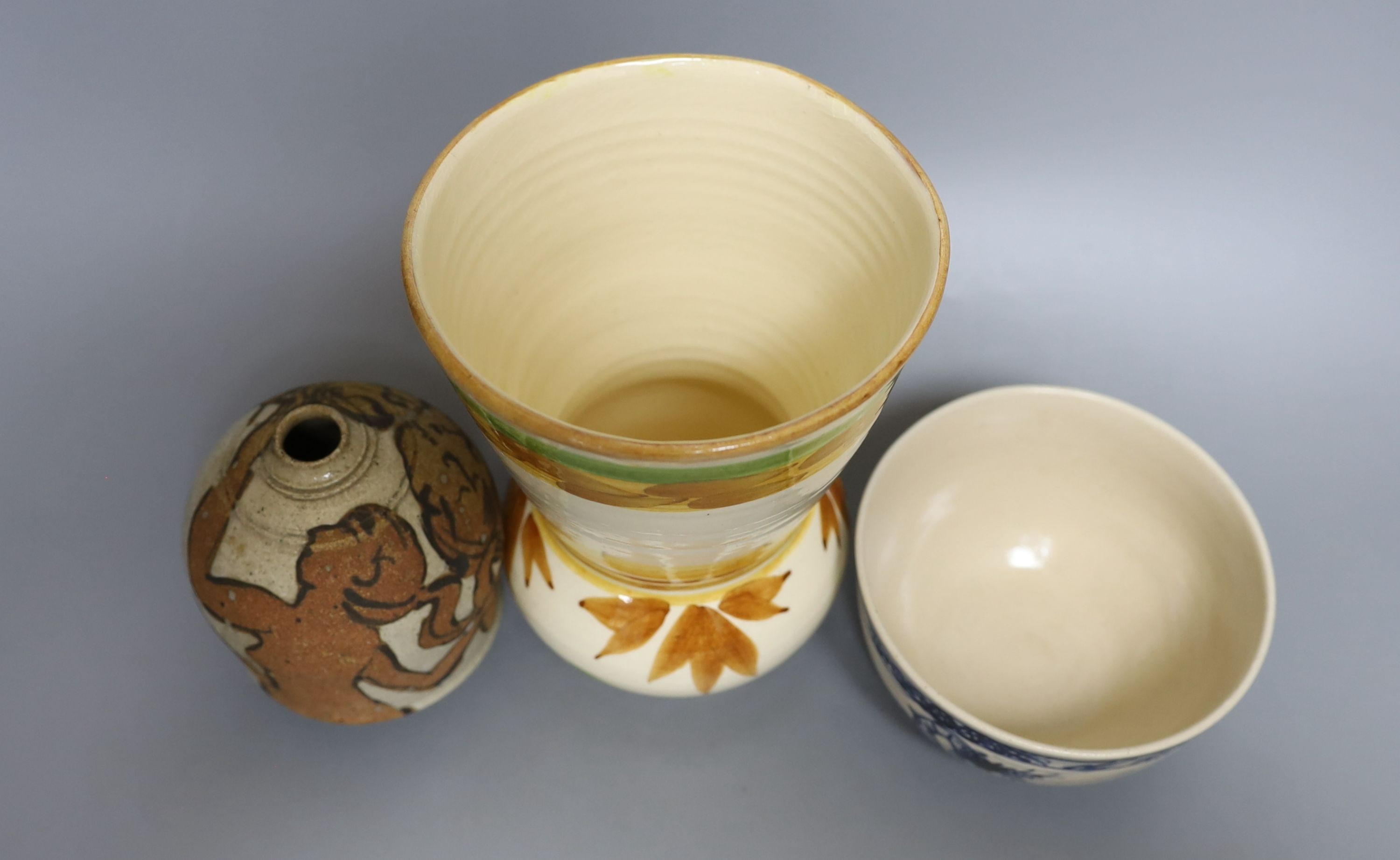 Three pieces of Yolande Beer pottery, to include a vase, ‘griffin’ bowl and a stoneware figural vase, tallest 17cm